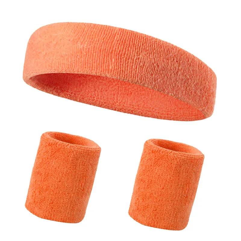 A multi-pack of bright orange knitted sports headbands for fitness and activity.