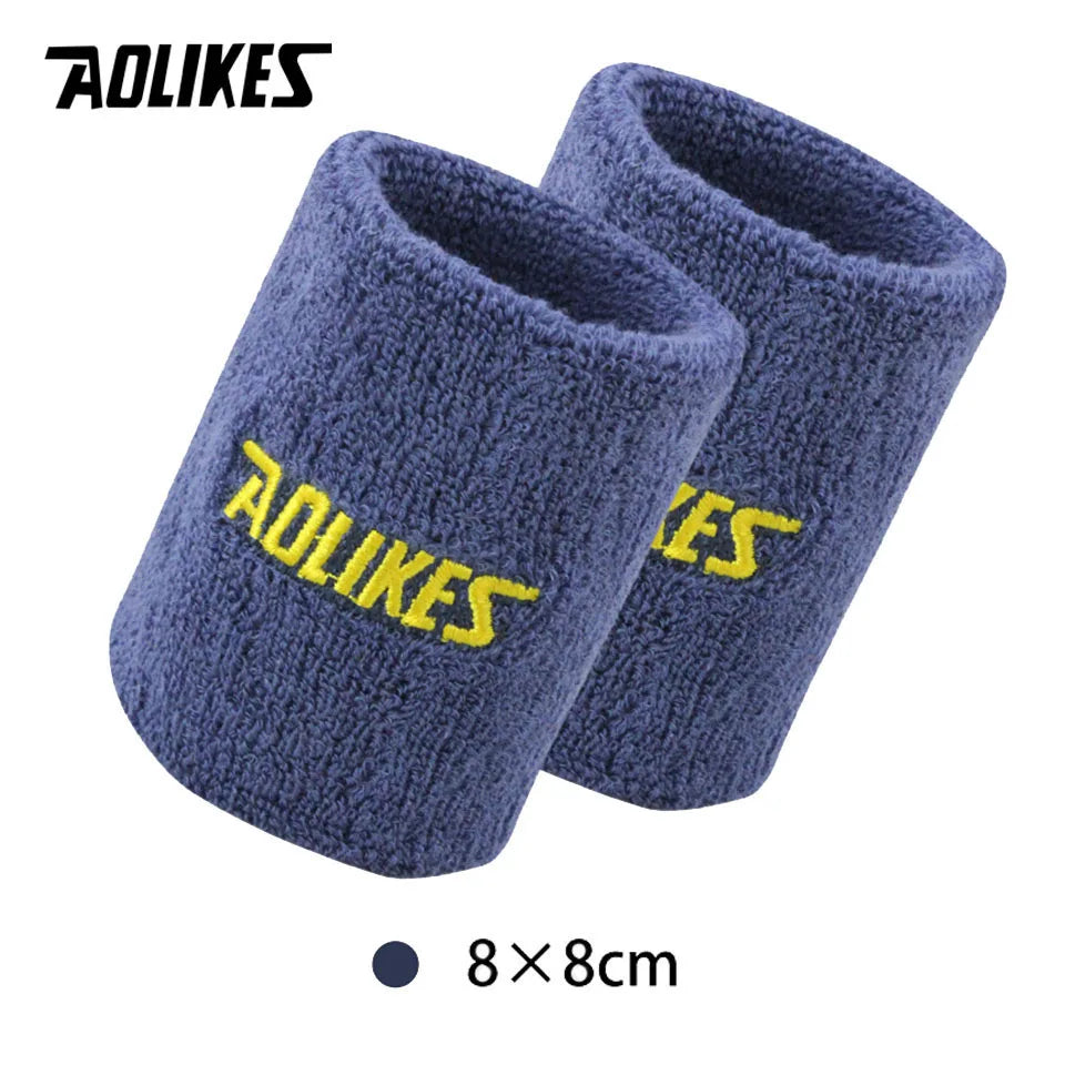 A pair of dark blue knitted sport wristbands for activewear