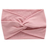 A light pink women's elastic sports headband tied in a knot.