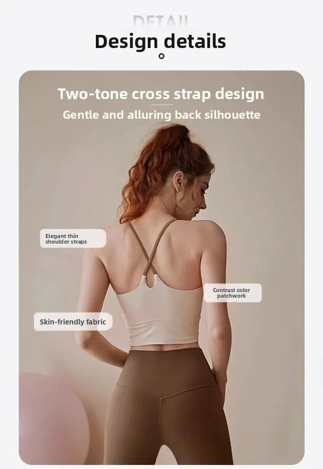 A woman wearing a two-tone cross strap sports bra with a gentle back silhouette and skin-friendly fabric.