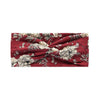 A burgundy fabric headband featuring a vintage floral print with cream and green accents.