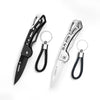 A pair of folding stainless steel survival knives with black handles and leather cord attachments.