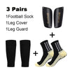 A set of three pairs of black football socks, leg covers, and leg guards for sports.