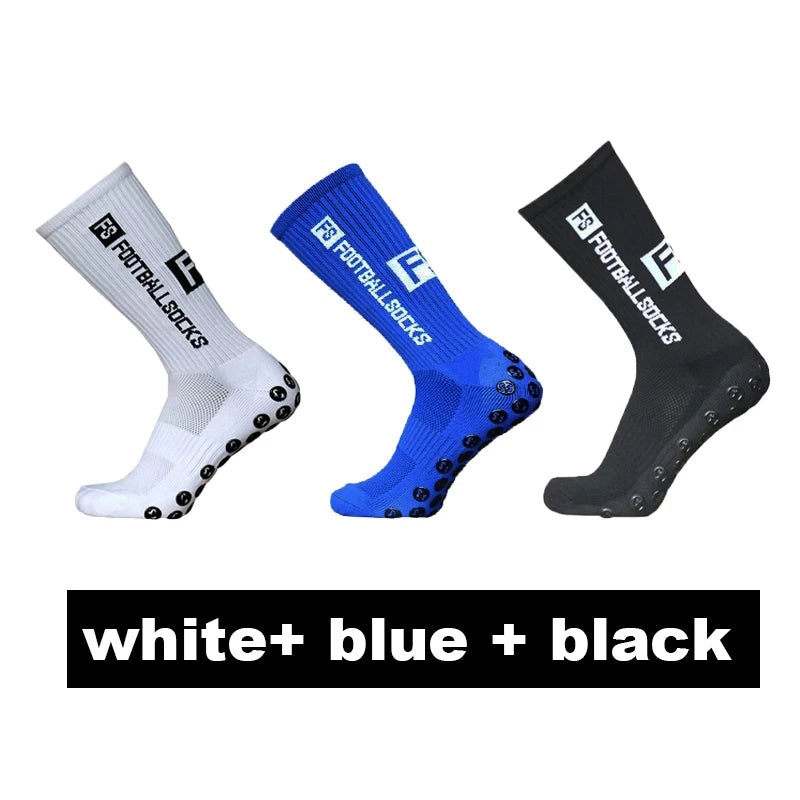 Three pairs of anti-slip silicone grip football socks in white, blue, and black.