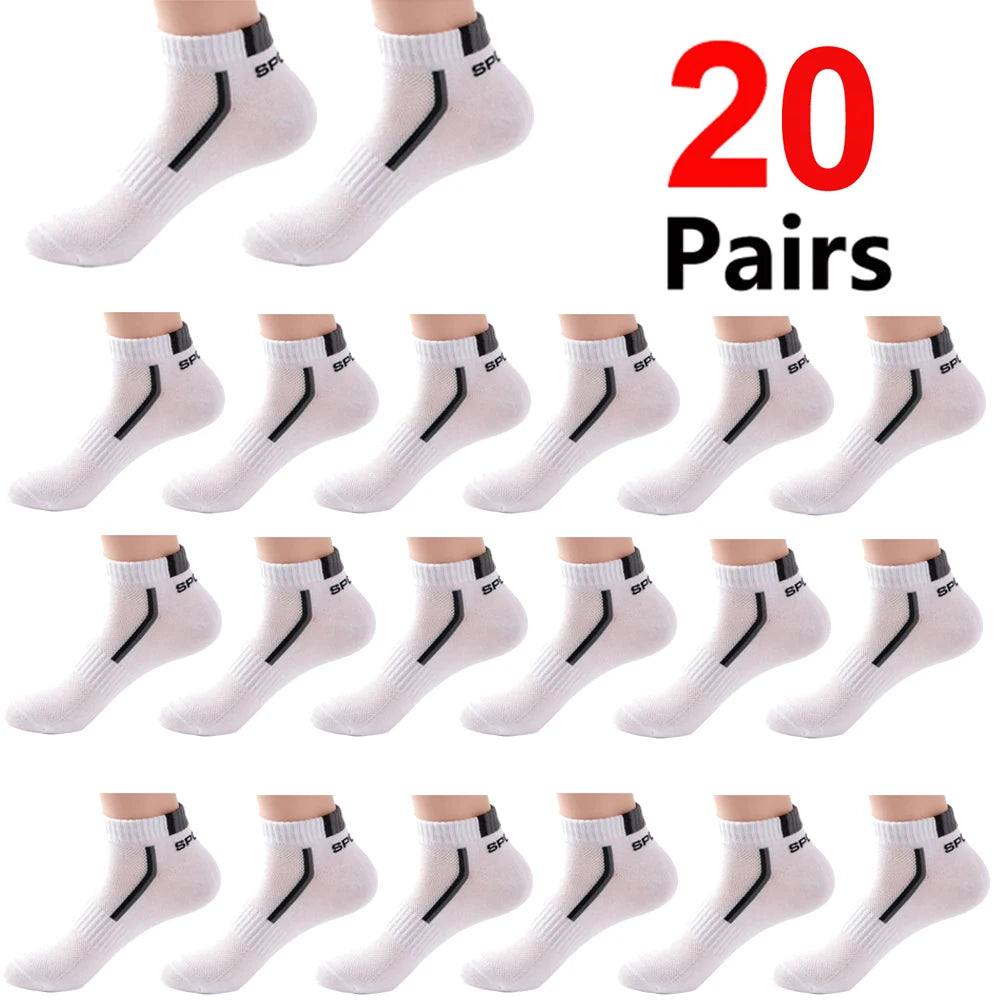 A collection of white and black color-block mesh ankle socks displayed in various styles.