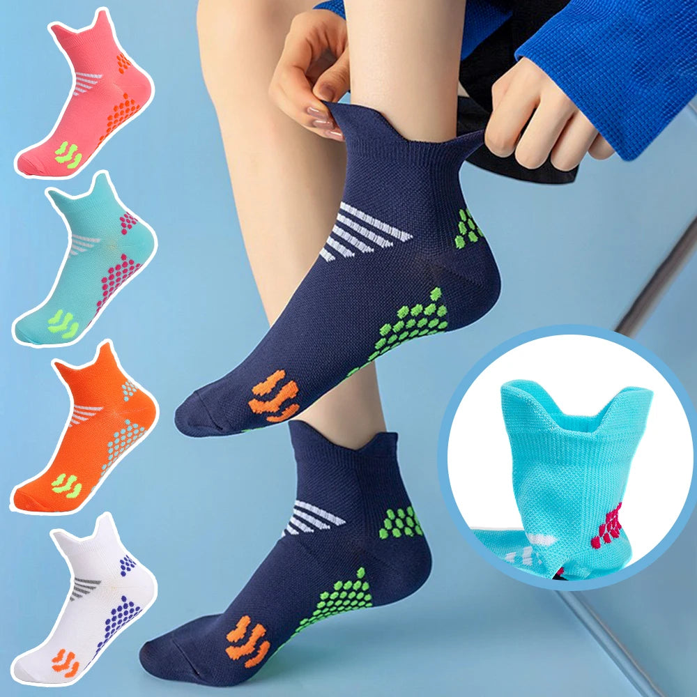 A collection of colorful massage and compression running socks displayed on a person's leg.