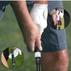 A hand grips a white golf club grip trainer device for posture correction, showing the grip mechanism.