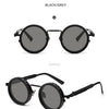 Black and grey polarized round sunglasses shown in a product show display.