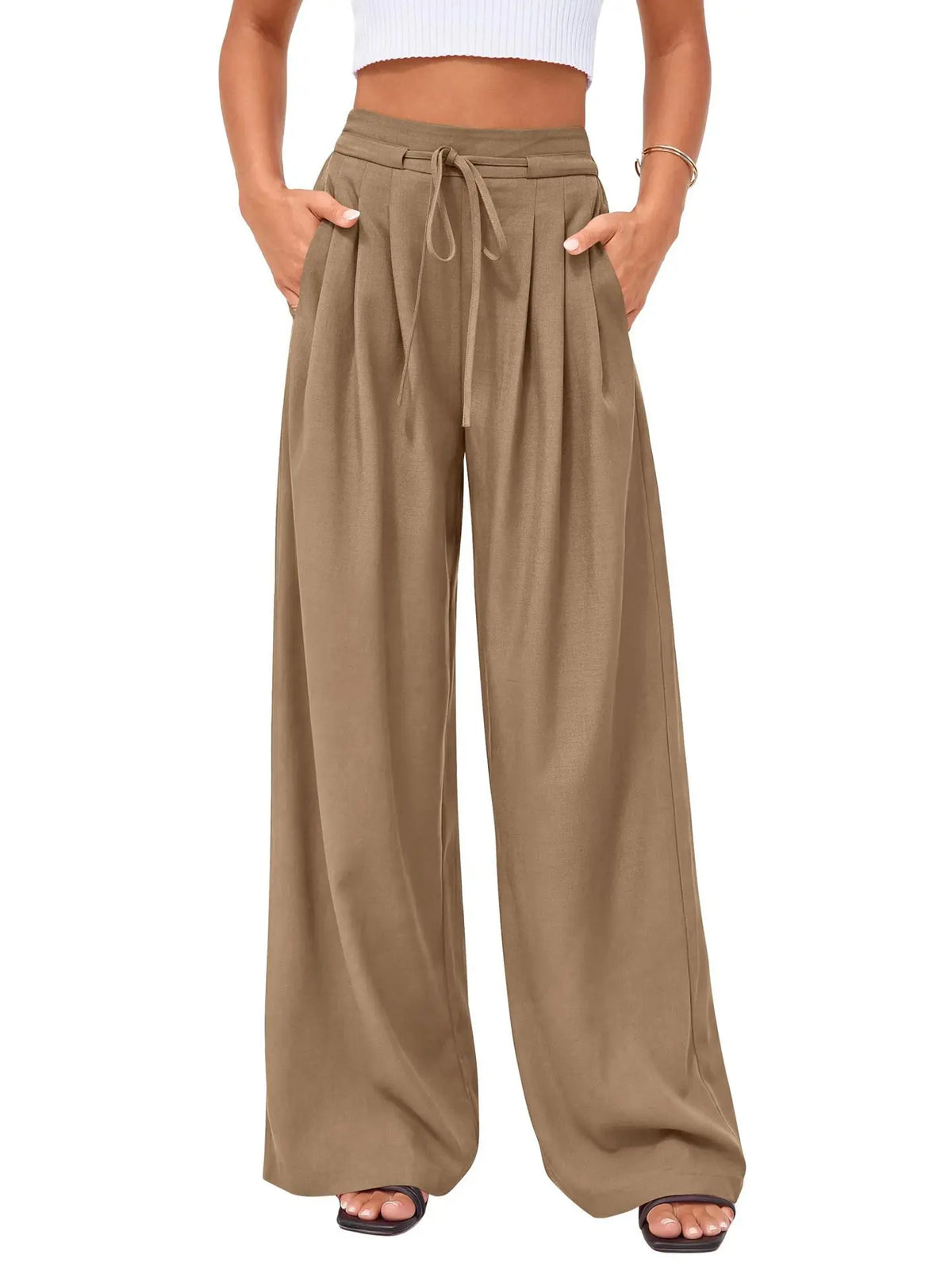 A model is wearing flowy high waist drawstring wide leg pants in a khaki green color.