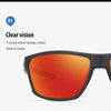 A close-up view of orange-tinted polarized sunglasses with a black frame.