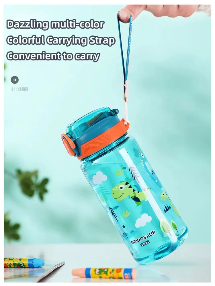 A clear dinosaur-themed silicone straw water bottle with a colorful carrying strap is held above it.