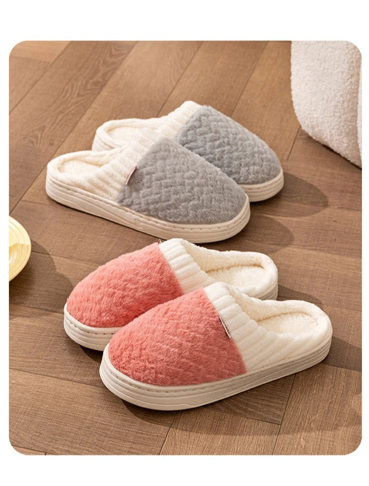 A set of cozy plush fleece slippers in beige, gray, and pink are displayed on a wooden floor.