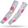 Pair of light pink sports arm sleeves featuring a floral pattern with pink and blue flowers and butterflies.