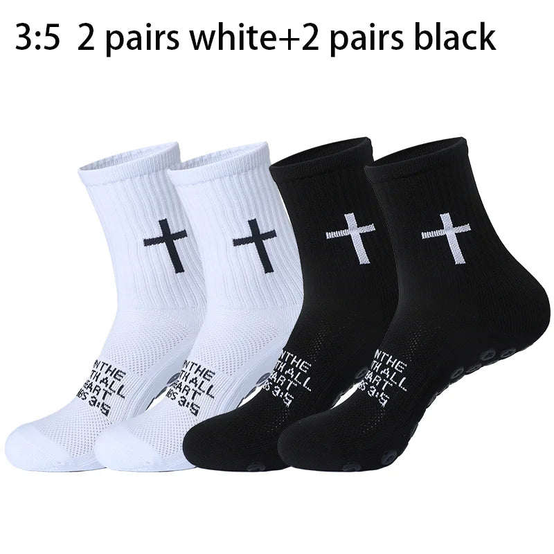 A collection of five pairs of white and five pairs of black prayer and cross grip sports socks.
