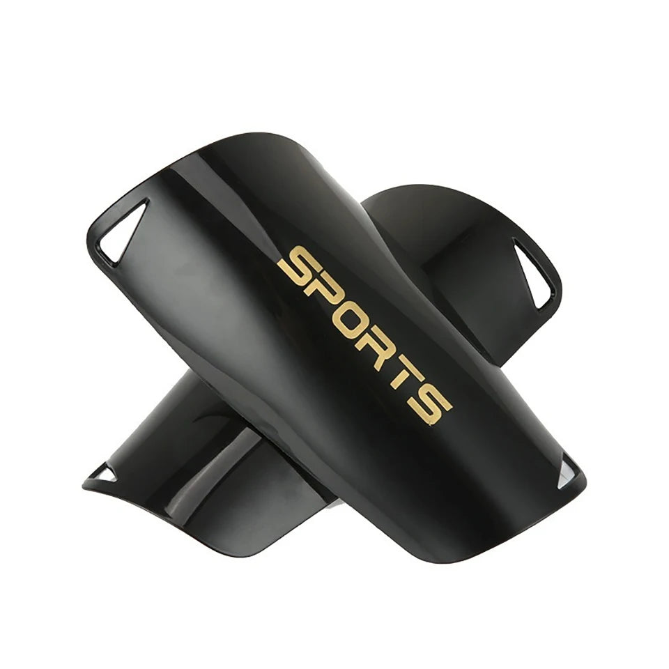 Black sports shin guards shown from the side with the word SPORTS visible on the surface