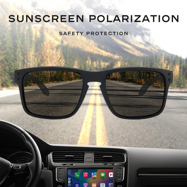 Paire de lunettes de soleil avec protection polarisée et protection solaire vues à travers un pare-brise de voiture.