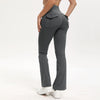 A model wearing dark gray high-waisted flared yoga leggings with a front pocket detail.