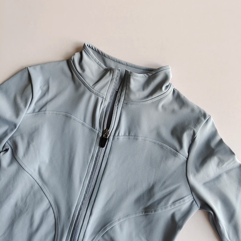 Light blue quick-dry yoga and fitness jacket shown in a close-up view