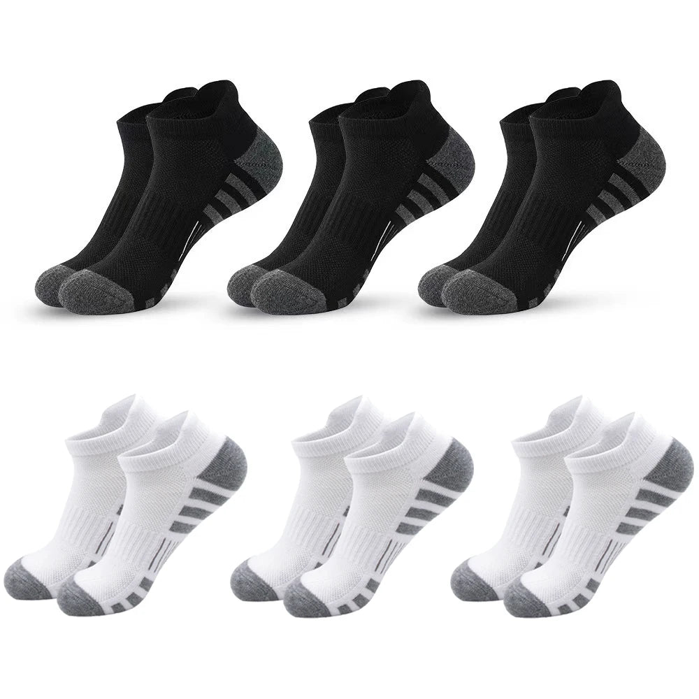 A set of black and white athletic running socks for men and women displayed in various styles.