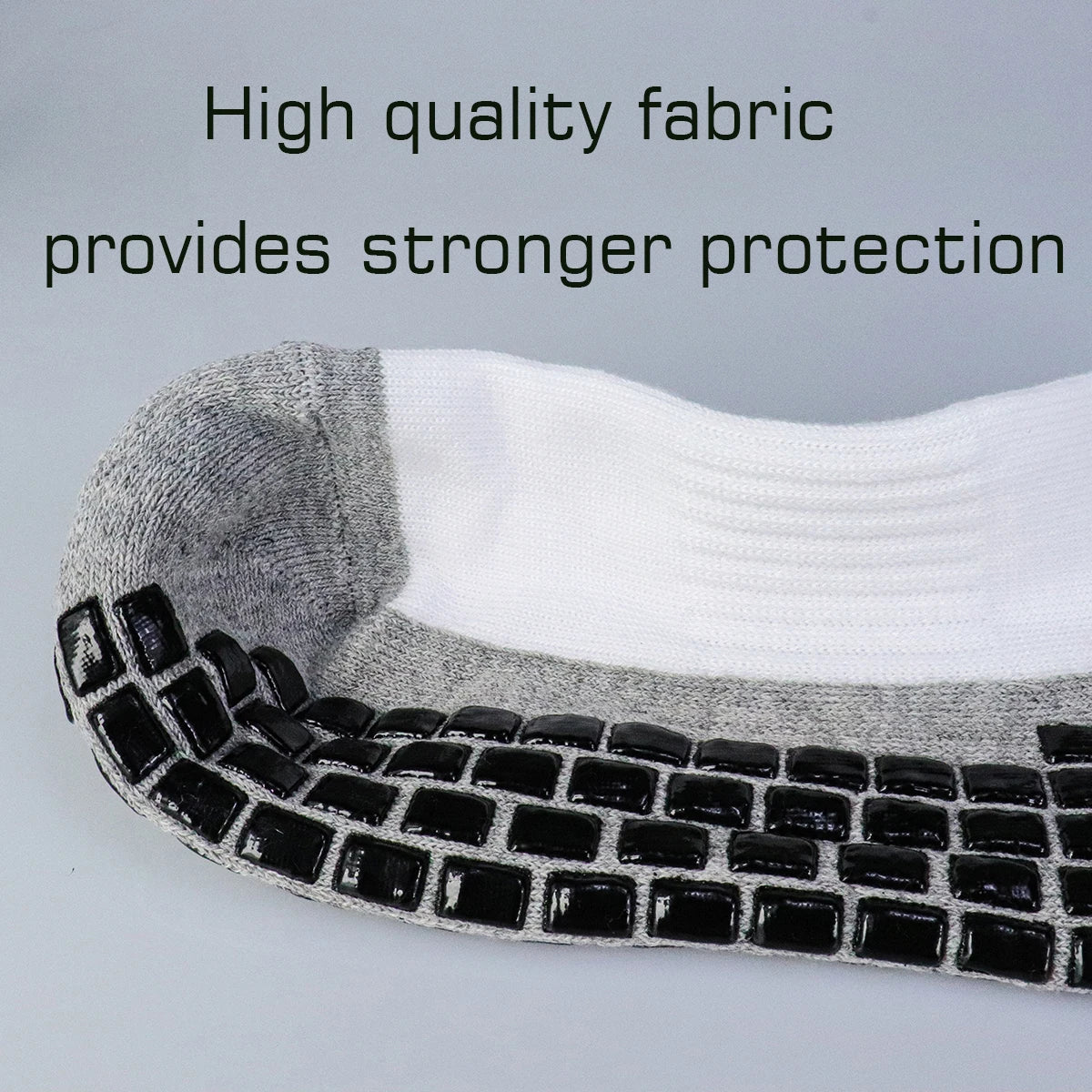 Close-up of professional training football socks showing a layered design of gray and white fabric.