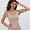 A model wearing a beige zippered body shaper slimming bodysuit for tummy control.