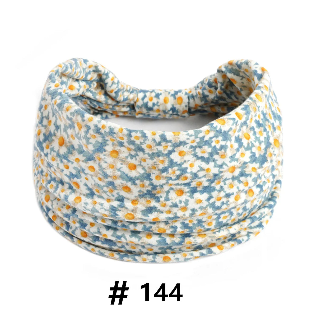 Bandeau en coton stretch à motifs floraux bleu clair et blanc, enroulé en spirale.