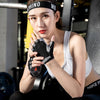 A woman wearing black breathable half-finger sport gloves while exercising or cycling.