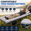 A man relaxing on a portable padded mattress cot outdoors with a tent in the background.