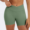 A model wearing olive green seamless high-waist yoga leggings.