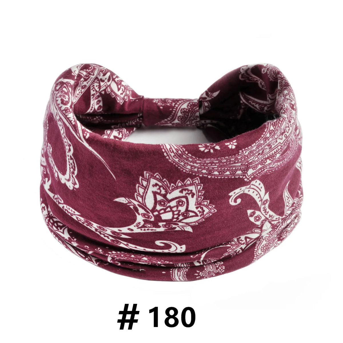 A maroon boho print cotton headband tied in a bow.