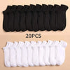 A set of 20 pairs of black and white breathable unisex boat socks laid out for display.