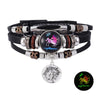 Pulsera de cuero con cuentas y un colgante que representa el signo zodiacal de Sagitario.