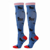 Pair of blue compression elastic socks featuring a repeating black cat pattern and red trim.