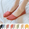 A pair of terracotta silicone anti-slip summer socks worn on a person's feet against a white background.