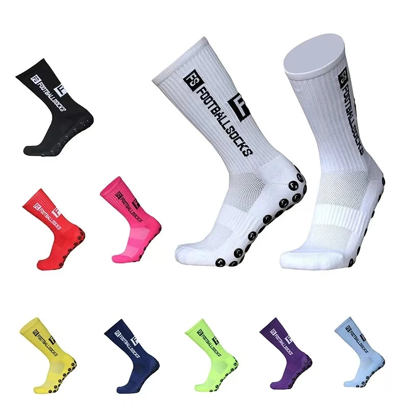 A collection of black, pink, white, and various colored anti-slip silicone grip football socks displayed in different angles.