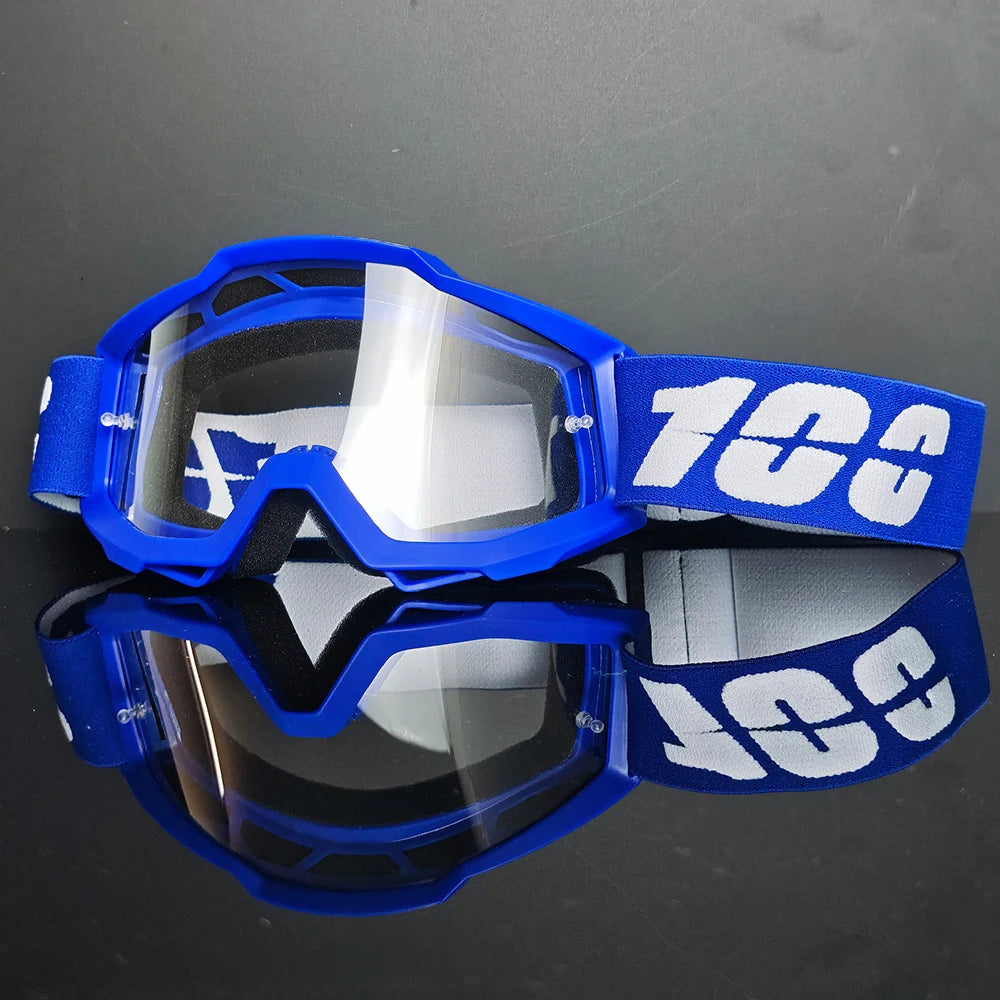 Gafas de motocross azules con texto blanco en la correa y lente reflectante