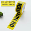 A roll of yellow industrial safety warning tape with the text DO NOT ENTER visible on the label.