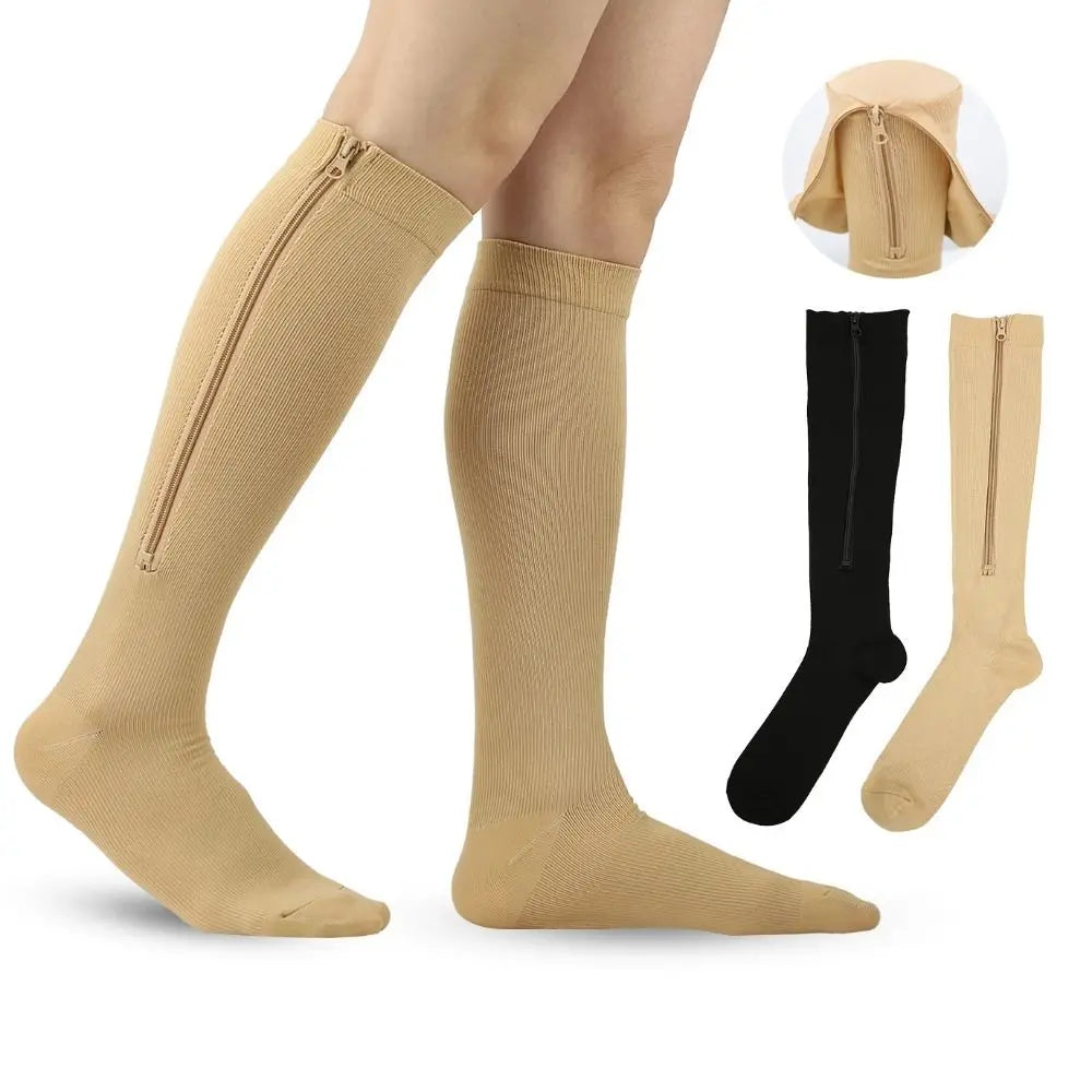 A set of high elasticity compression socks in beige and black colors shown on a foot.