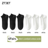 A set of six pairs of men's combed cotton socks in black and white colors.