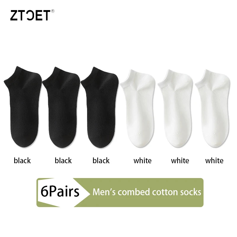 A set of six pairs of men's combed cotton socks in black and white colors.