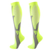 A pair of neon yellow compression socks with a gray anatomical design.