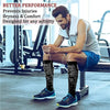 A man wearing black graduated compression socks is sitting on a gym bench in a fitness setting.