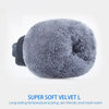 A close-up of a gray velvet pom-pom or ball used as a product for winter sports gloves.