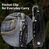 A black folding stainless steel survival knife is shown next to a denim pocket for everyday carry.