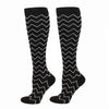 Pair of black compression elastic socks with a white chevron pattern