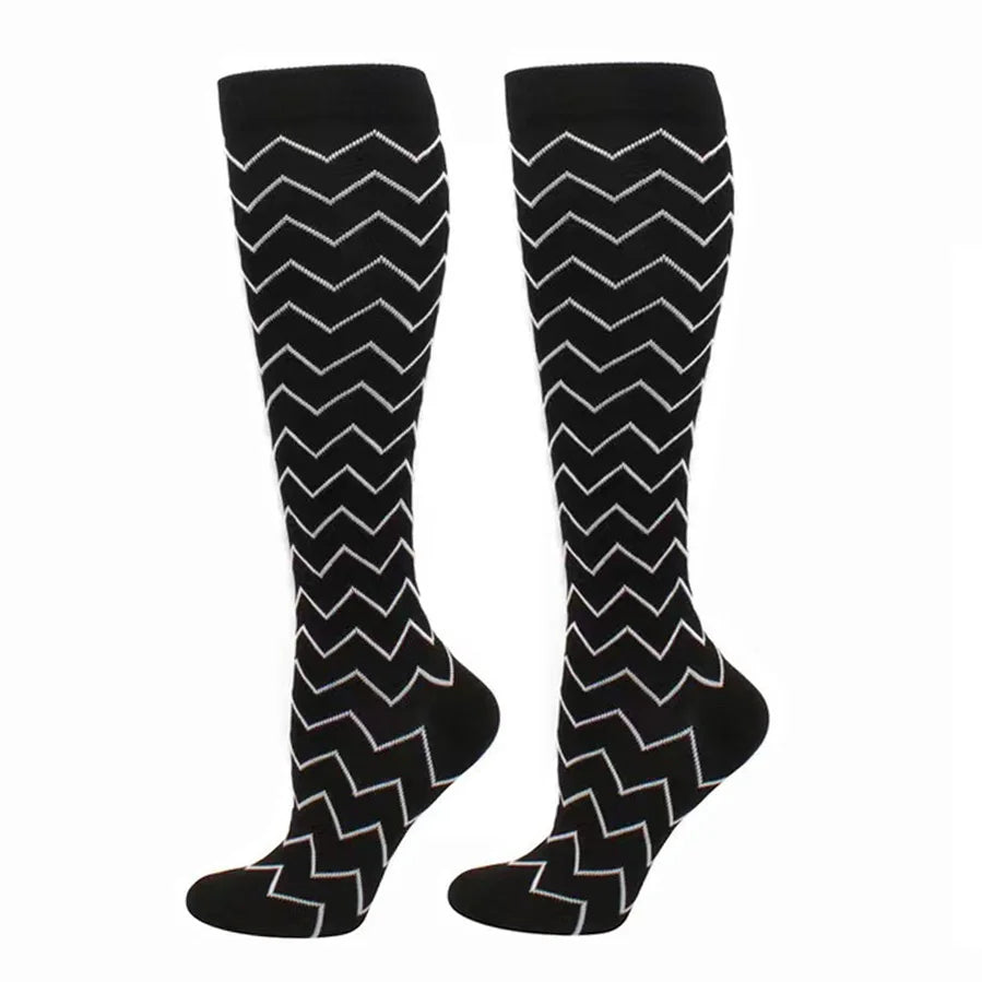 Pair of black compression elastic socks with a white chevron pattern