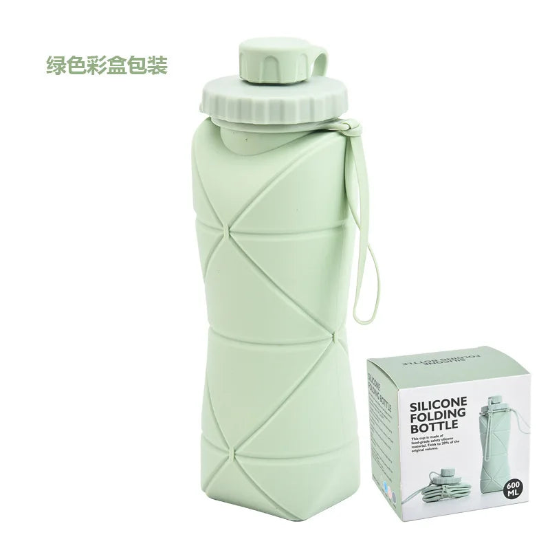 A light green silicone collapsible sports water bottle with a screw cap and carrying loop.