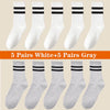 A collection of 10 pairs of white and gray athletic socks displayed in various styles.