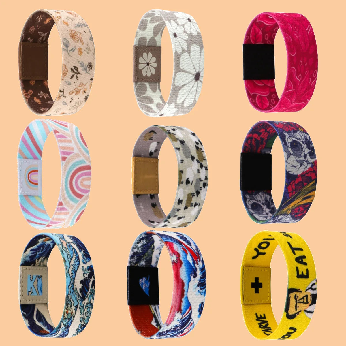A collection of colorful stretch silicone wristbands featuring various floral and abstract patterns.