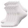A stack of white men's essential warm socks for outdoor activities